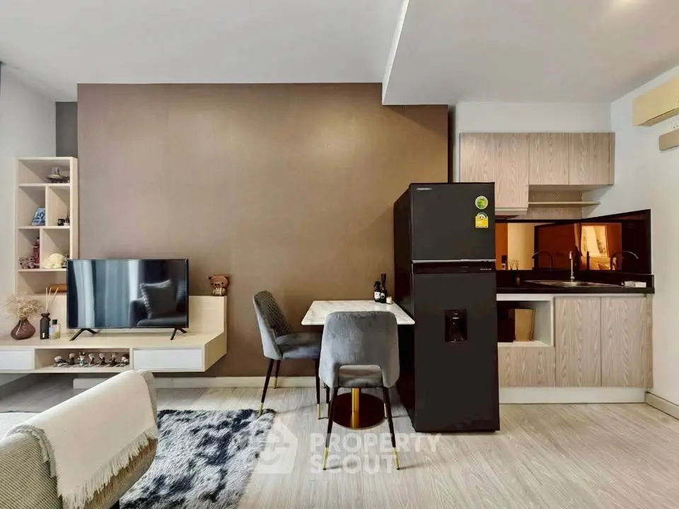 Modern open-plan living room with sleek kitchen and stylish decor