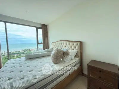Luxurious bedroom with stunning ocean view and elegant furnishings