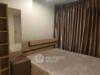 Cozy bedroom with elegant curtains and modern furnishings, perfect for a restful retreat.
