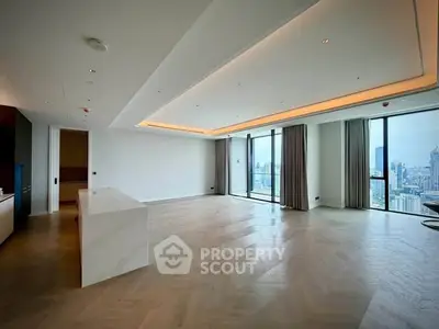 Spacious modern living room with panoramic city views and elegant lighting.