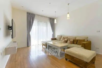 Spacious living room with modern decor and natural light