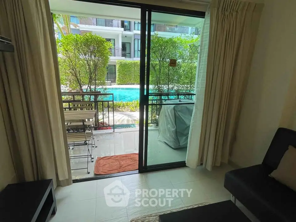 Charming apartment with pool view and cozy balcony access
