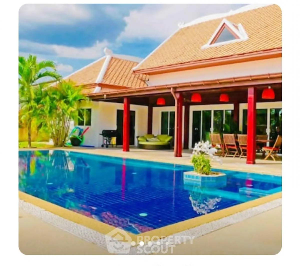 Luxurious villa with private pool and spacious patio in tropical setting