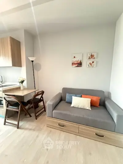 Modern living room with cozy sofa and dining area in stylish apartment