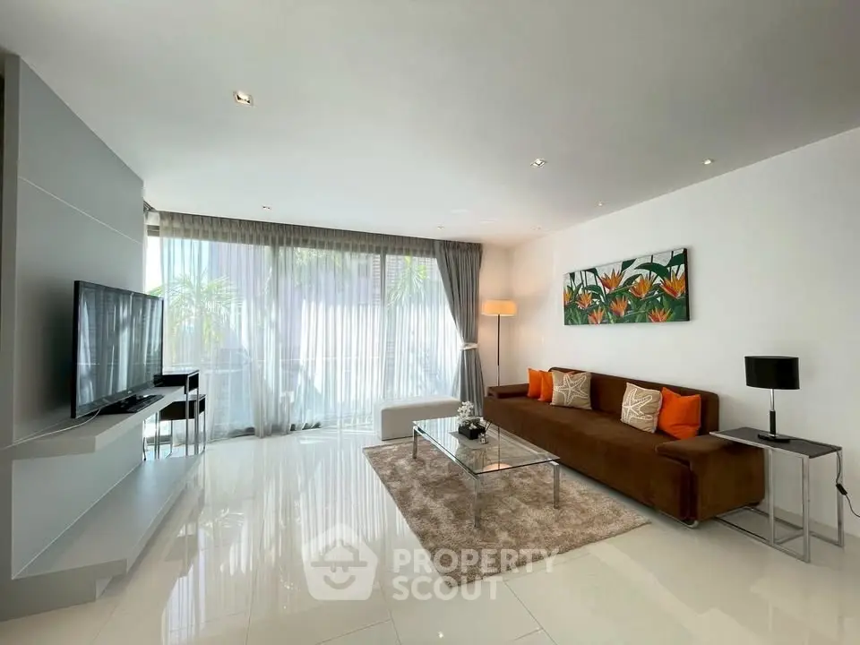 Spacious modern living room with sleek decor and large windows