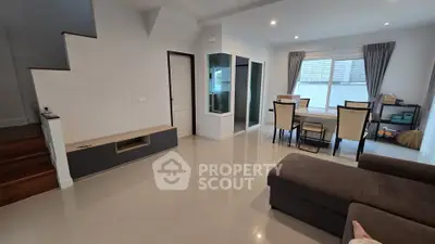 Spacious modern living room with sleek furniture and natural light