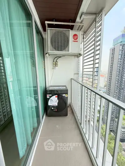 Modern balcony with washing machine and city view in high-rise apartment