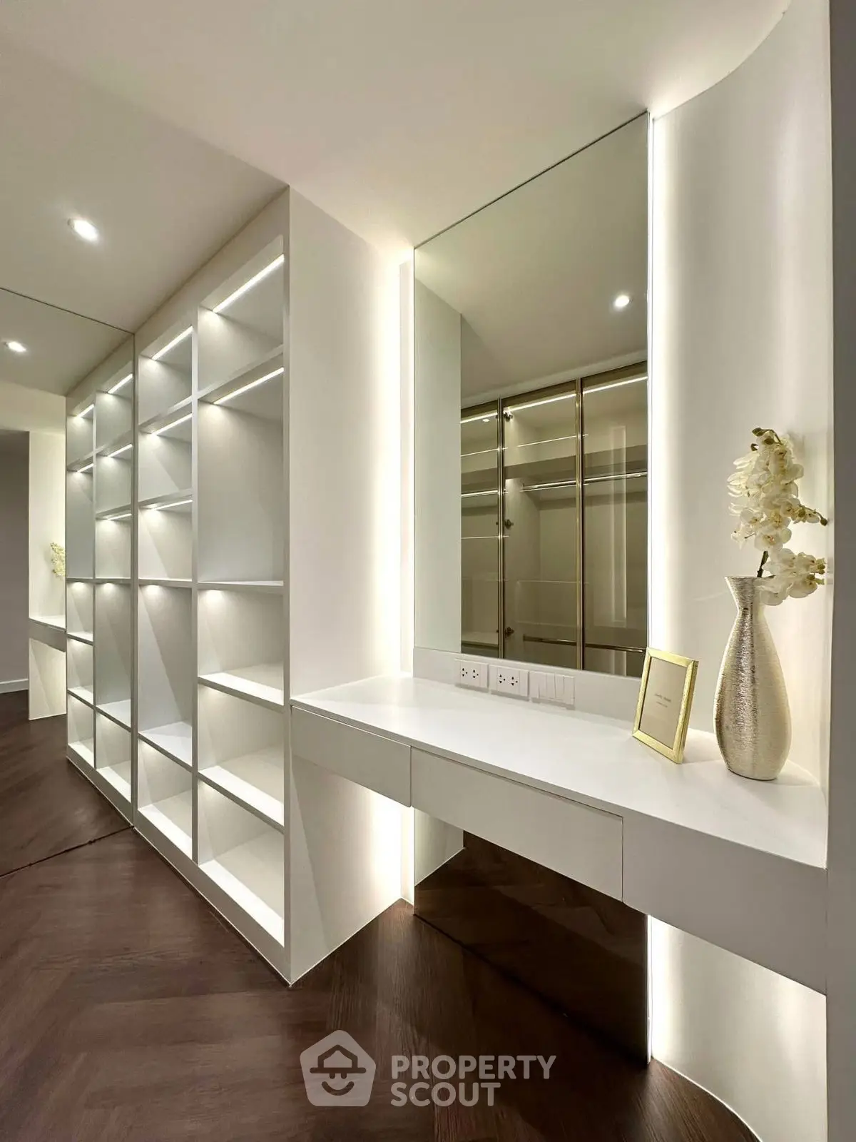 Luxurious modern walk-in closet with sleek shelving and elegant decor