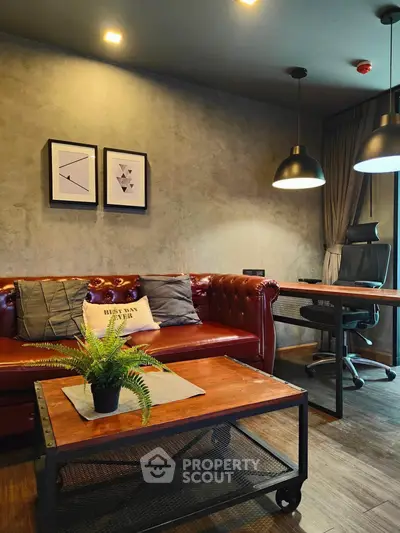 Stylish living room with leather sofa, modern decor, and workspace area, perfect for urban living.
