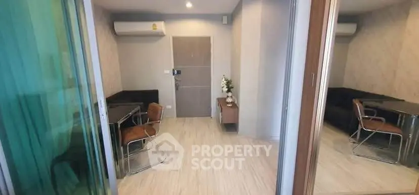 Modern living room with sleek furniture and air conditioning