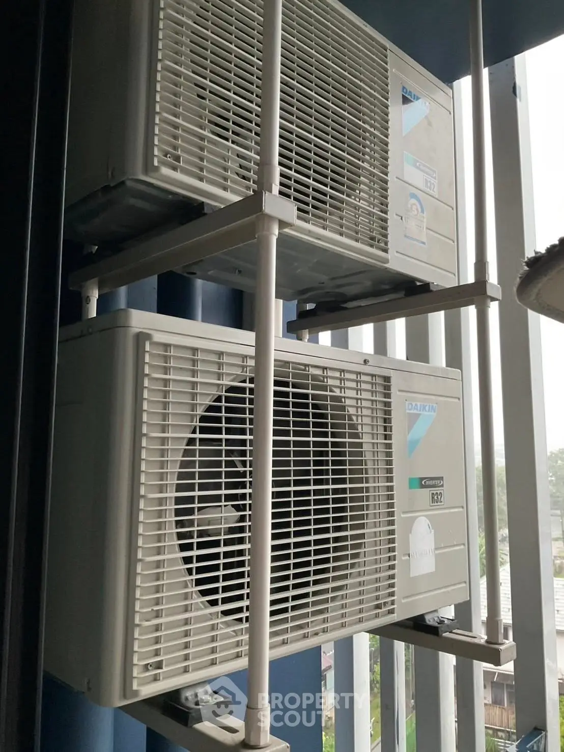 Outdoor air conditioning units on a modern building facade