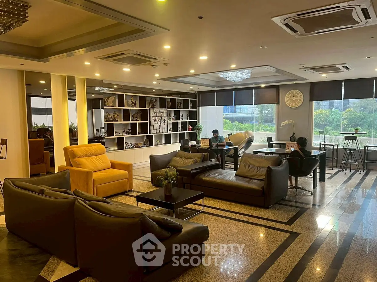 Luxurious modern lobby with elegant seating and large windows offering scenic views.