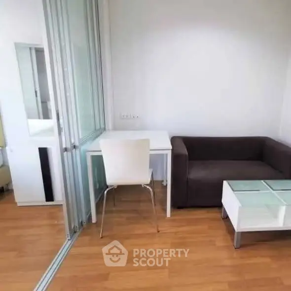 Modern living room with sleek furniture and wooden flooring