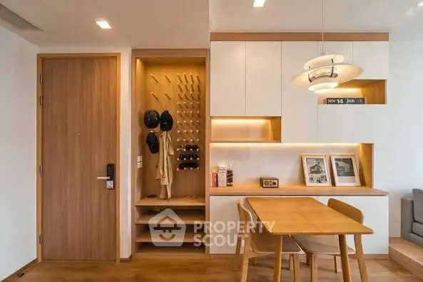 Modern dining area with wooden accents and stylish lighting