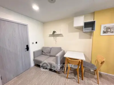 Cozy living room with modern decor and compact dining area