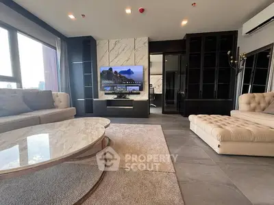 Luxurious modern living room with elegant furniture and large windows offering stunning views.