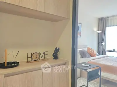 Modern bedroom with stylish decor and cozy ambiance, featuring a comfortable bed and elegant furnishings.