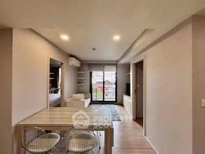 Modern living room with dining area and large window in stylish apartment