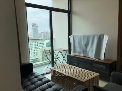 Modern living room with balcony view in urban apartment