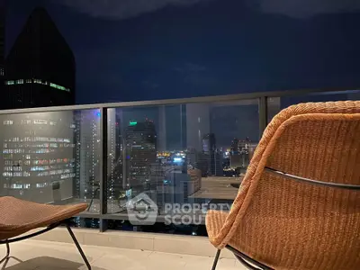 Stunning cityscape view from a modern balcony at night, perfect for urban living enthusiasts.