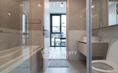 Modern bathroom with sleek design and bathtub in contemporary apartment