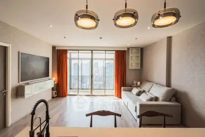 Spacious modern living room with city view and elegant lighting
