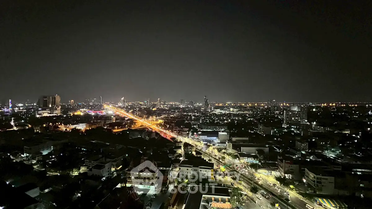 Stunning night cityscape view from high-rise apartment balcony