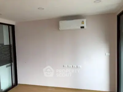 Modern minimalist room with air conditioning and wooden flooring