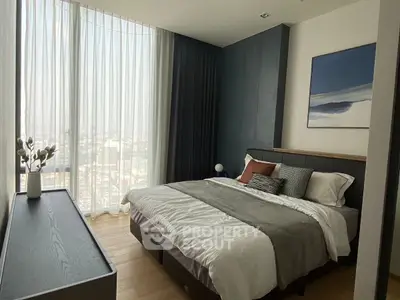 Luxurious bedroom with stunning city view and modern decor