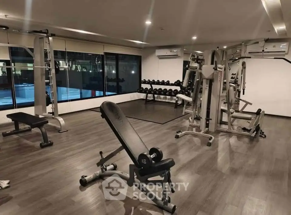 Modern gym with state-of-the-art equipment in a luxury residential building.