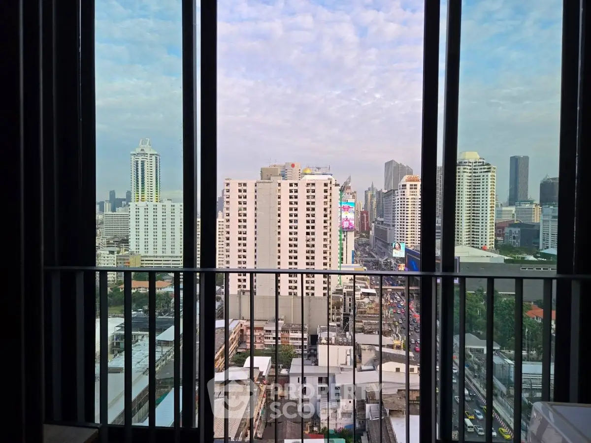 Stunning cityscape view from a high-rise balcony with modern urban skyline.