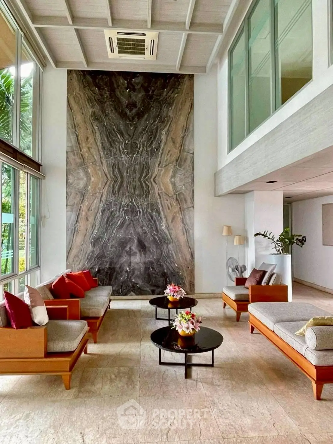 Luxurious living room with high ceiling and elegant decor