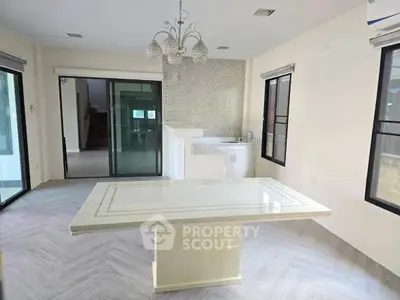 Spacious dining area with elegant chandelier and modern open layout