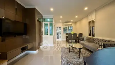 Spacious modern living room with elegant decor and dining area