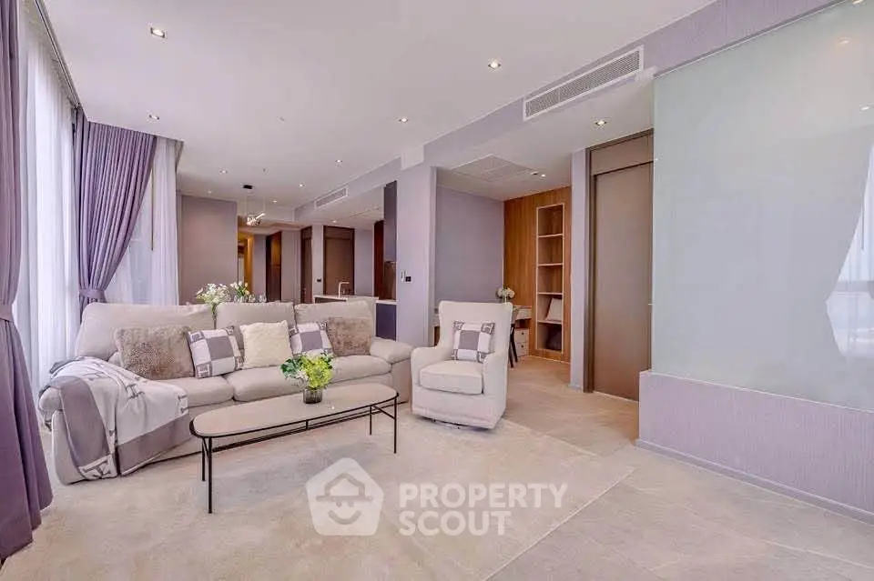 Luxurious modern living room with elegant decor and plush seating in a high-end apartment.