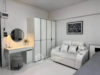 Modern living room with white furniture and stylish decor