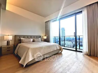 Luxurious bedroom with floor-to-ceiling windows offering stunning city views and elegant decor.