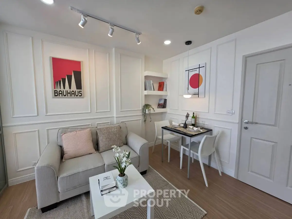 Stylish living room with modern decor and cozy dining area in a contemporary apartment.