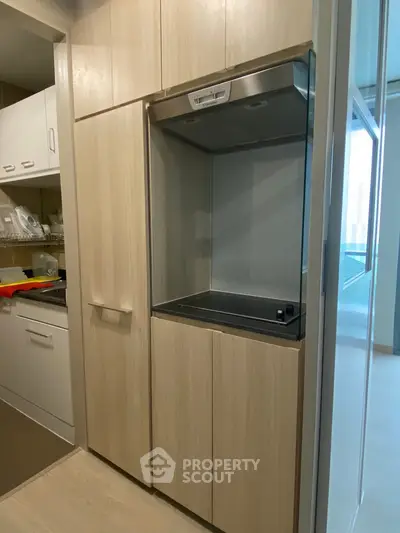 Modern kitchen with sleek cabinetry and built-in appliances