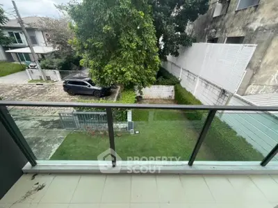 Spacious balcony with garden view in modern residential area