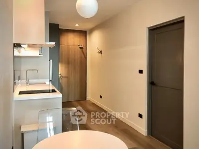 Modern kitchen with sleek design and open layout in a stylish apartment.