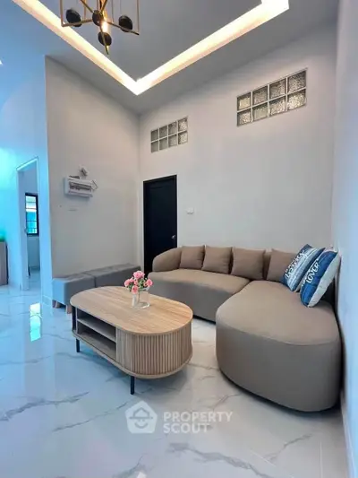 Modern living room with stylish furniture and elegant lighting in a contemporary home.