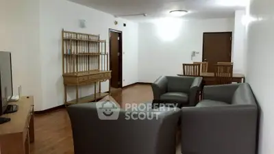 Spacious living room with modern furniture and wooden flooring