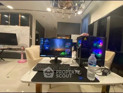 Modern home office setup with gaming PC and elegant decor