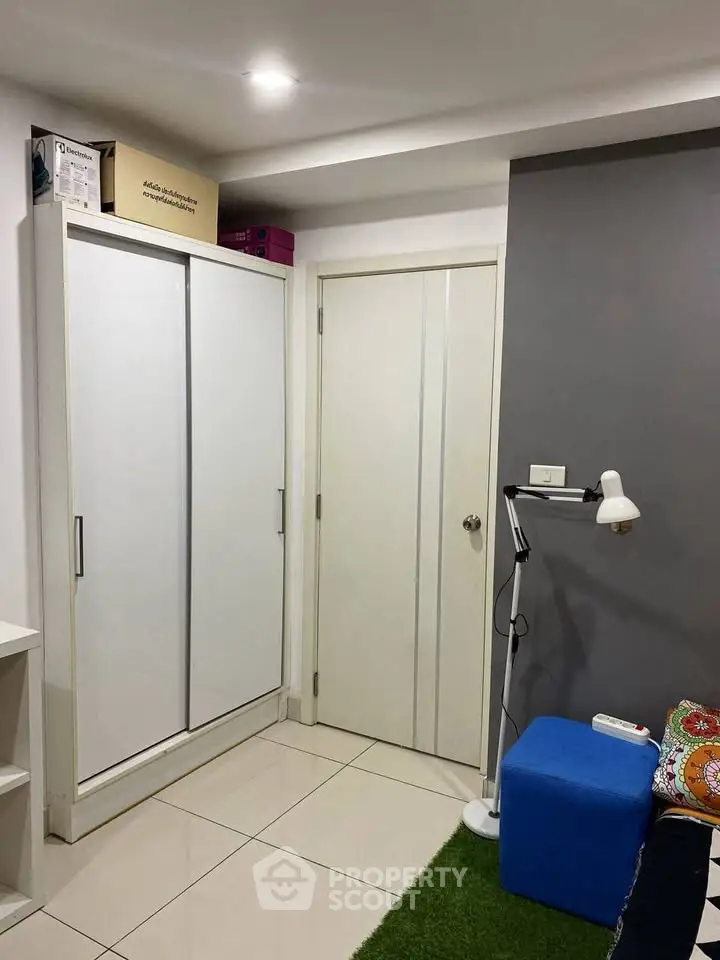 Modern small room with white wardrobe and cozy decor