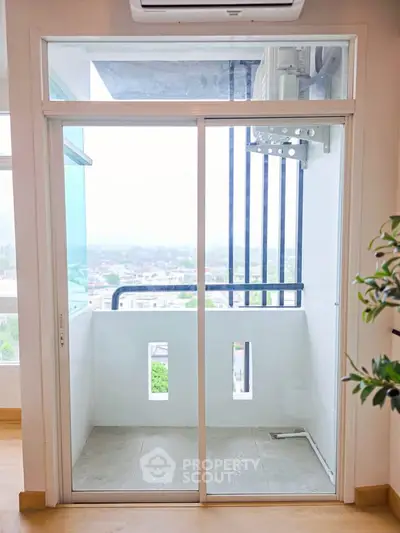 Charming apartment balcony with scenic view, perfect for relaxation and enjoying the outdoors.