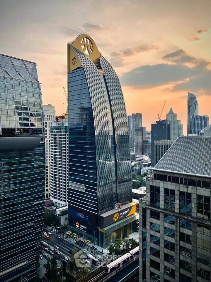 Stunning modern skyscraper with unique architectural design in vibrant cityscape.