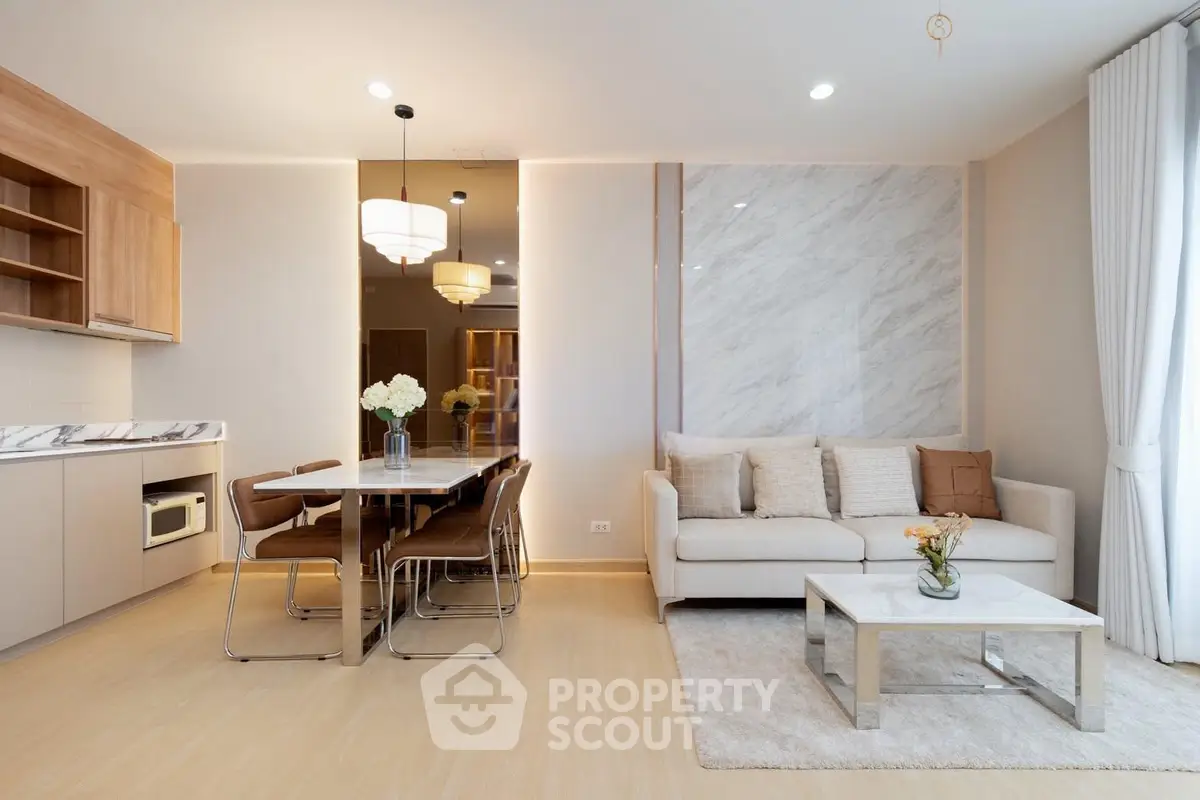 Modern open-plan living room with elegant dining area and stylish decor