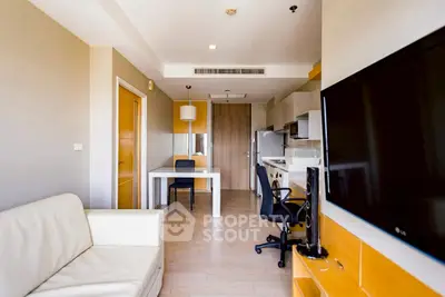 Modern living room with sleek furniture and open kitchen layout