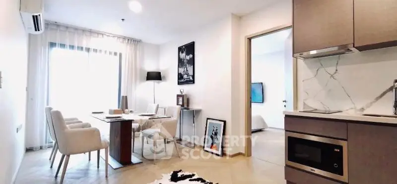Modern open-plan living and dining area with stylish decor and natural light.
